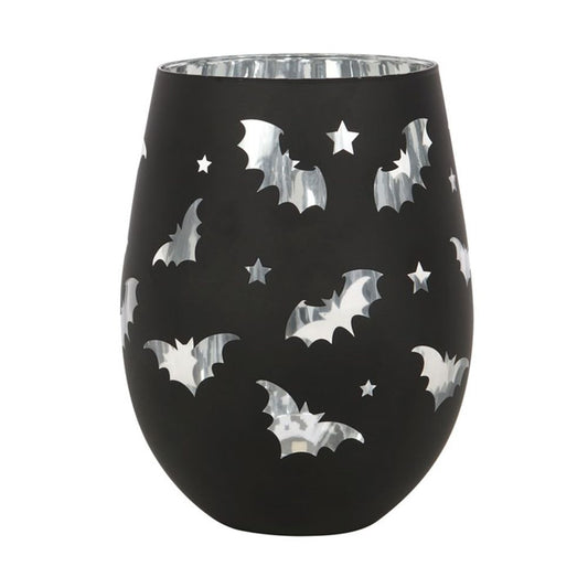 A black vase with a 500ml capacity features a pattern of shiny silver bats and stars cut-outs. The reflective surfaces contrast with the matte black finish, creating an eye-catching appearance. It boasts a rounded, smooth shape with a slightly wider top and even has a sleek silver interior.