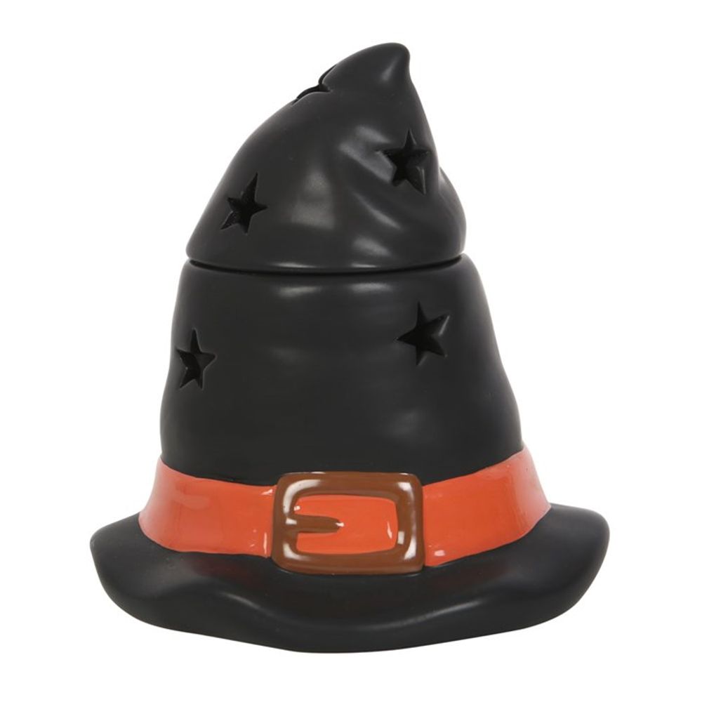 A ceramic container shaped like a witchs hat, perfect for spooky décor. Featuring cut-out stars, its black with an orange band and a brown buckle. The top is slightly tilted, and the glossy surface adds charm to any setting.