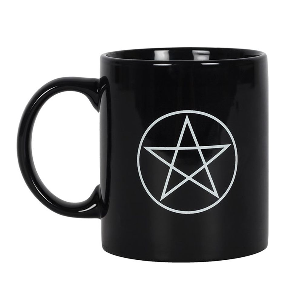 A black ceramic mug features a striking Wiccan Pentagram, displaying a white five-pointed star within a circle. Its large handle and glossy finish stand out against the plain white background.