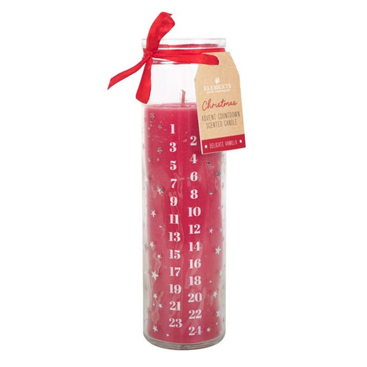 A tall red Advent candle in a clear glass jar, made from vegan paraffin wax and marked with white numbers 1–24. Decorated with white stars, a red bow, and a tag reading “Christmas Advent Countdown Scented Candle”.