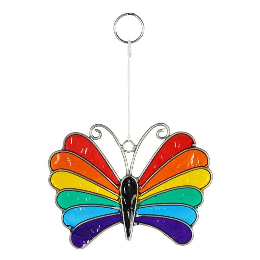 A vibrant rainbow butterfly suncatcher features ethically sourced stained glass wings in a symphony of red, orange, yellow, green, blue, and purple. It has a silver outline and black body with curly antennae. This colourful creation hangs from a thin white string attached to a small silver ring at the top.