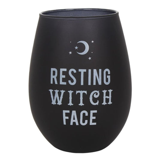 A black, rounded mug from the Black Magic collection features the phrase Resting Witch Face in white, stylised text. Above the phrase is a crescent moon surrounded by small stars. The mug has a smooth, matt finish.