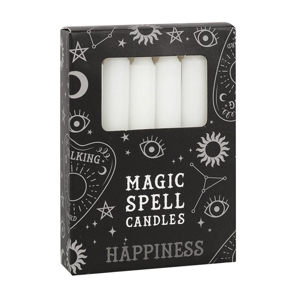 A box of Magic Spell Candles labelled for Happiness displays white spell candles through a clear window. The black packaging, ideal for rituals and promoting spiritual growth, is decorated with mystical symbols such as stars, moons, eyes, and constellations in a white design.