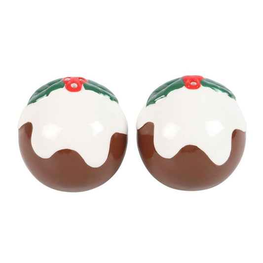 Two round ceramic objects shaped like Christmas puddings, topped with white icing, green holly leaves, and red berries—this charming Christmas salt and pepper set makes perfect festive tableware for your holiday spread.
