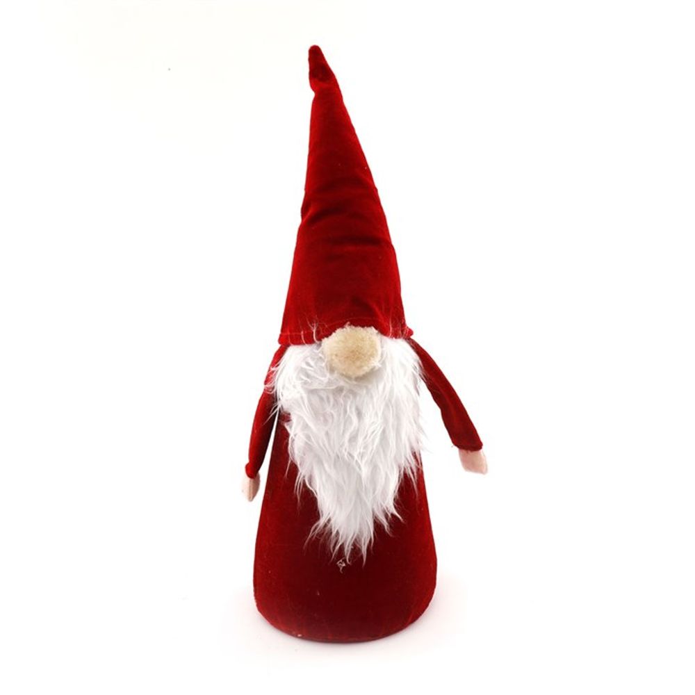 A plush Christmas gonk figure with a tall red hat, long white beard, and round beige nose stands upright against a plain white background. The gnome’s arms are slightly outstretched.