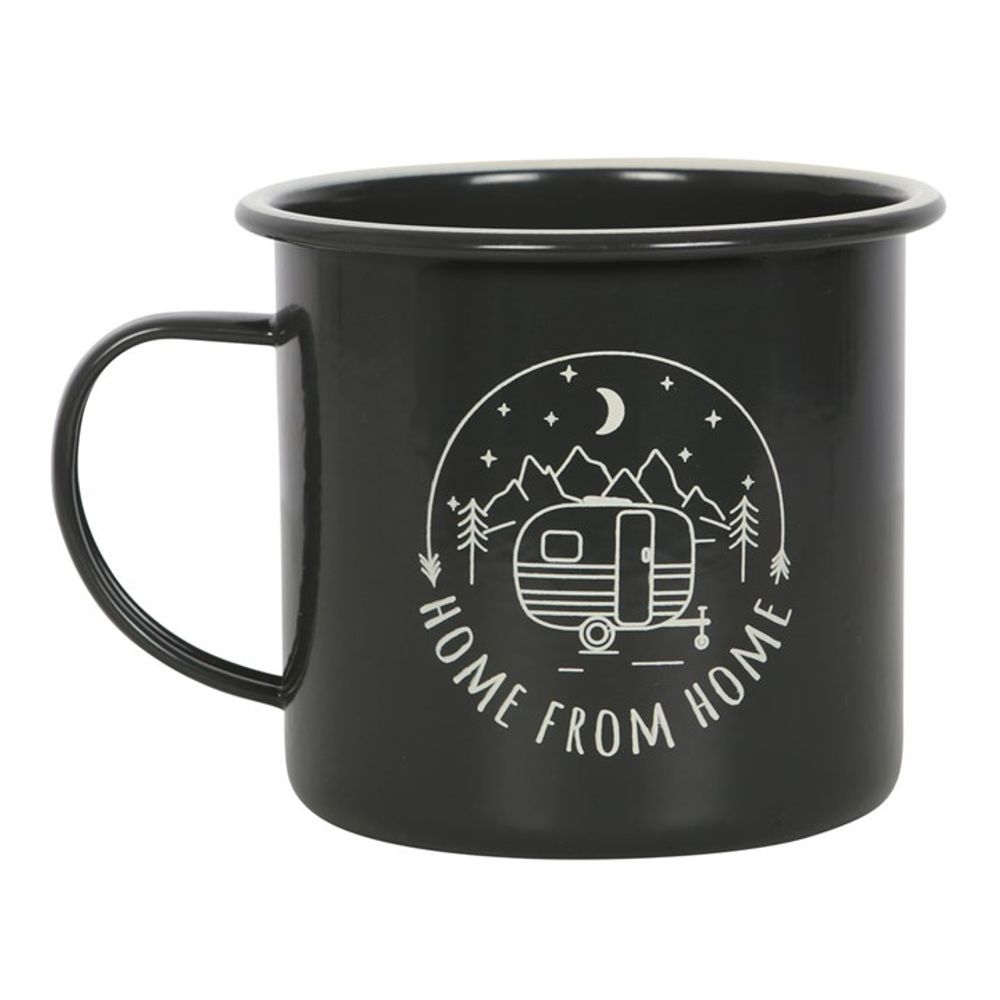 A dark green enamel mug featuring a white graphic of a caravan, pine trees, mountains, and a crescent moon. Home From Home arcs below the image. Ideal for camping trips, this mug has a curved handle on the left side.
