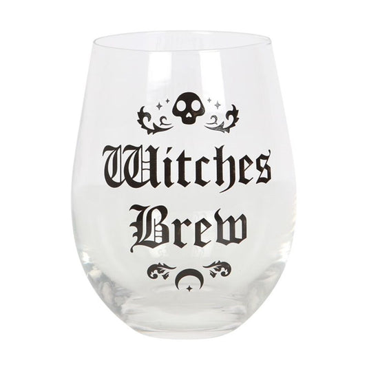 A stemless wine glass elegantly showcases Witches Brew in black Gothic font. Enchanting details feature a small skull and swirling patterns above the text, with a crescent moon and stars below. Perfect for magical potions or your favourite drink, this empty glass rests against a plain white background.