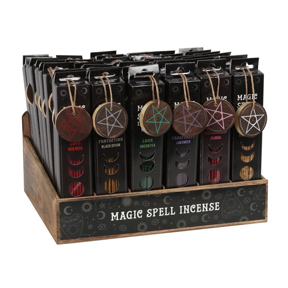 A wooden display box of Magic Spell Incense packs, each adorned with pentagram tags. These fragrance incense sticks feature scents such as Love (Red Rose) and Luck (Oriental). The box is elegantly decorated with moon, sun, and star symbols.