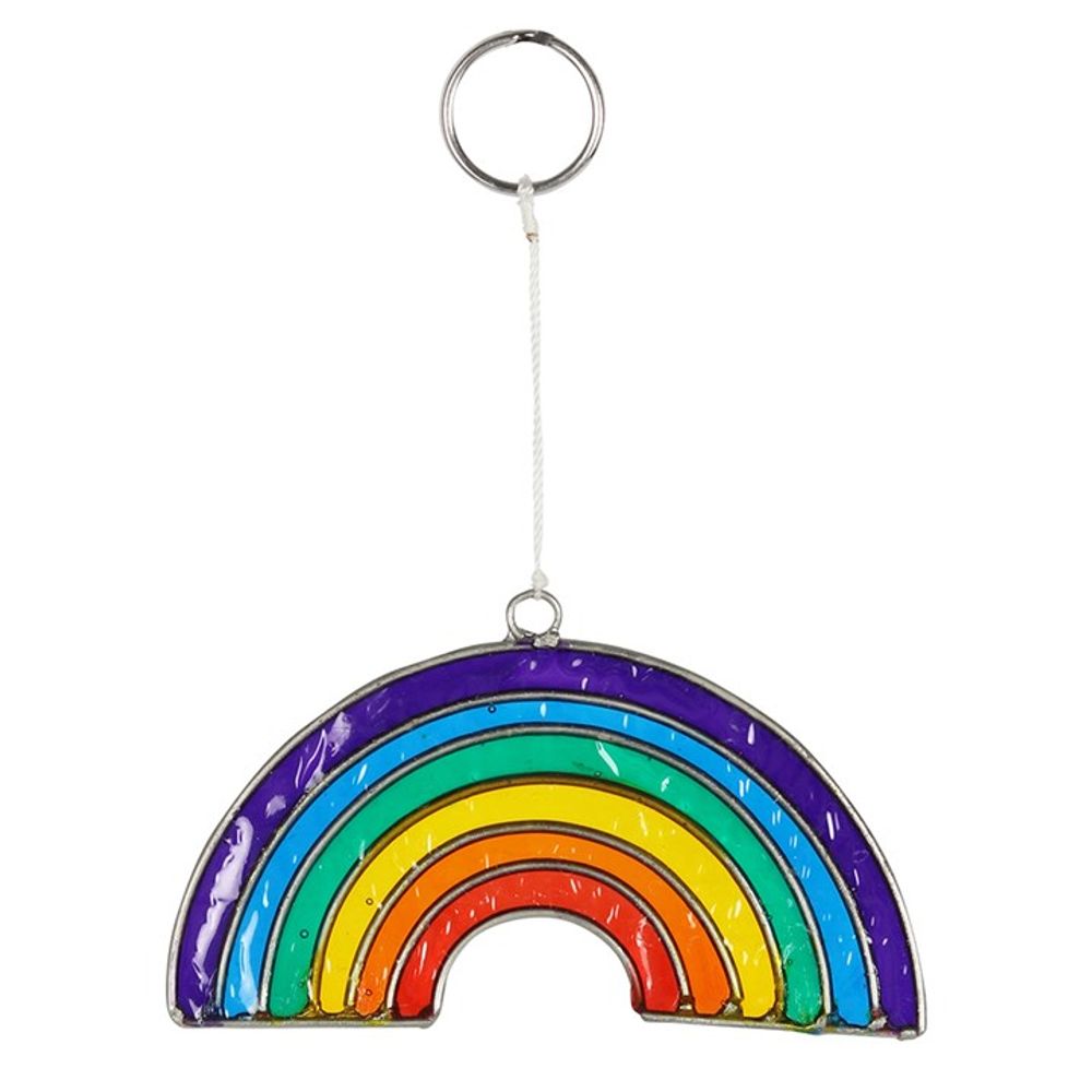 Rainbow keyring with six vivid colour arcs: purple, blue, green, yellow, orange, and red. Made from translucent coloured material bordered by silver to catch light reflections. It hangs from a white cord attached to a metal keyring.