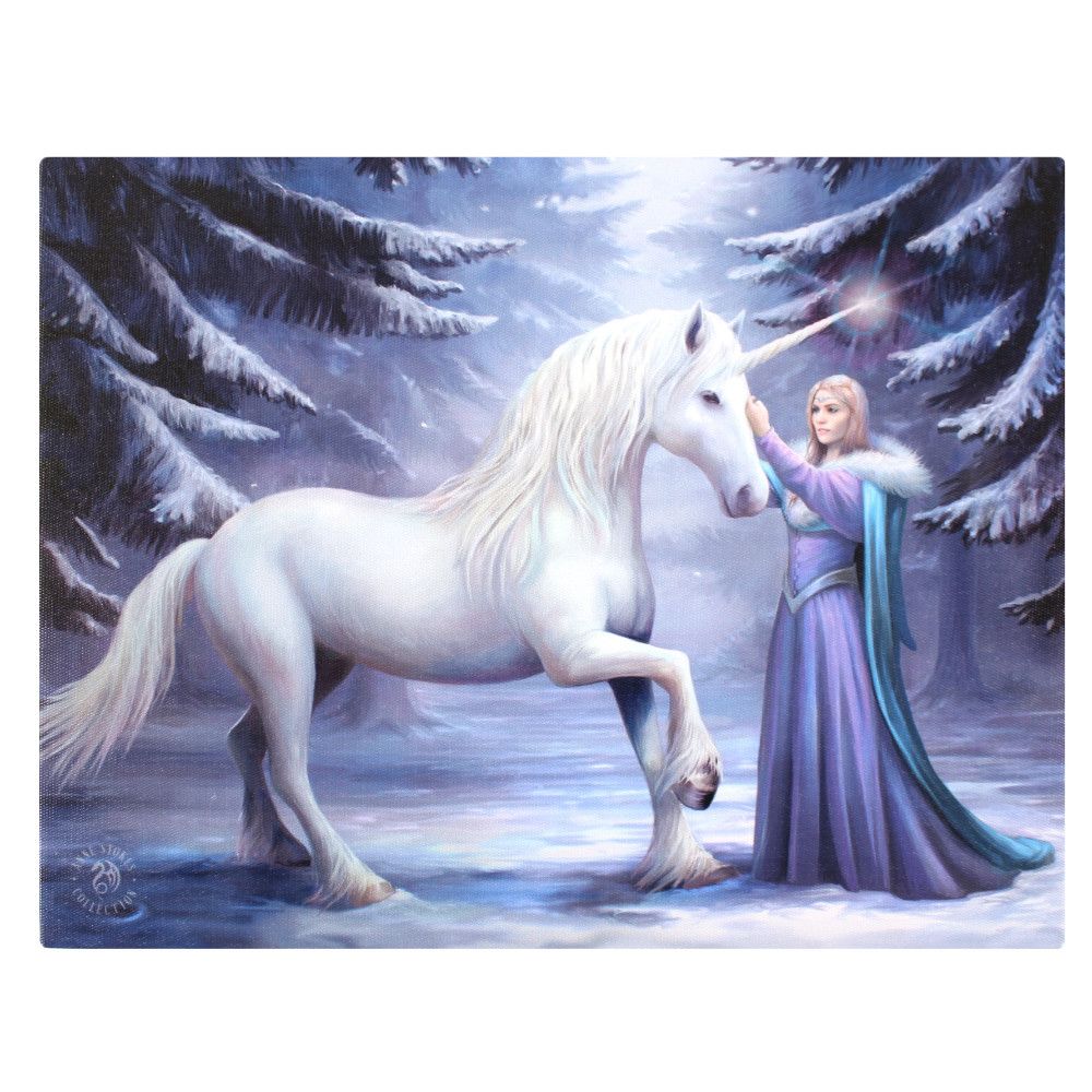 This canvas wall plaque features a snowy forest scene, depicting a white unicorn and a woman in a long purple dress. The unicorn raises one hoof as she gently touches its glowing horn, snow blanketing the trees to enhance the magical moment captured by Anne Stokes.
