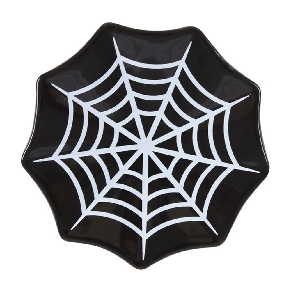 A black star-shaped spiderweb dish with a white, symmetrical web design at the centre. The plates slightly wavy edges add a dynamic touch, making it perfect as an elegant trinket organiser or jewellery holder.