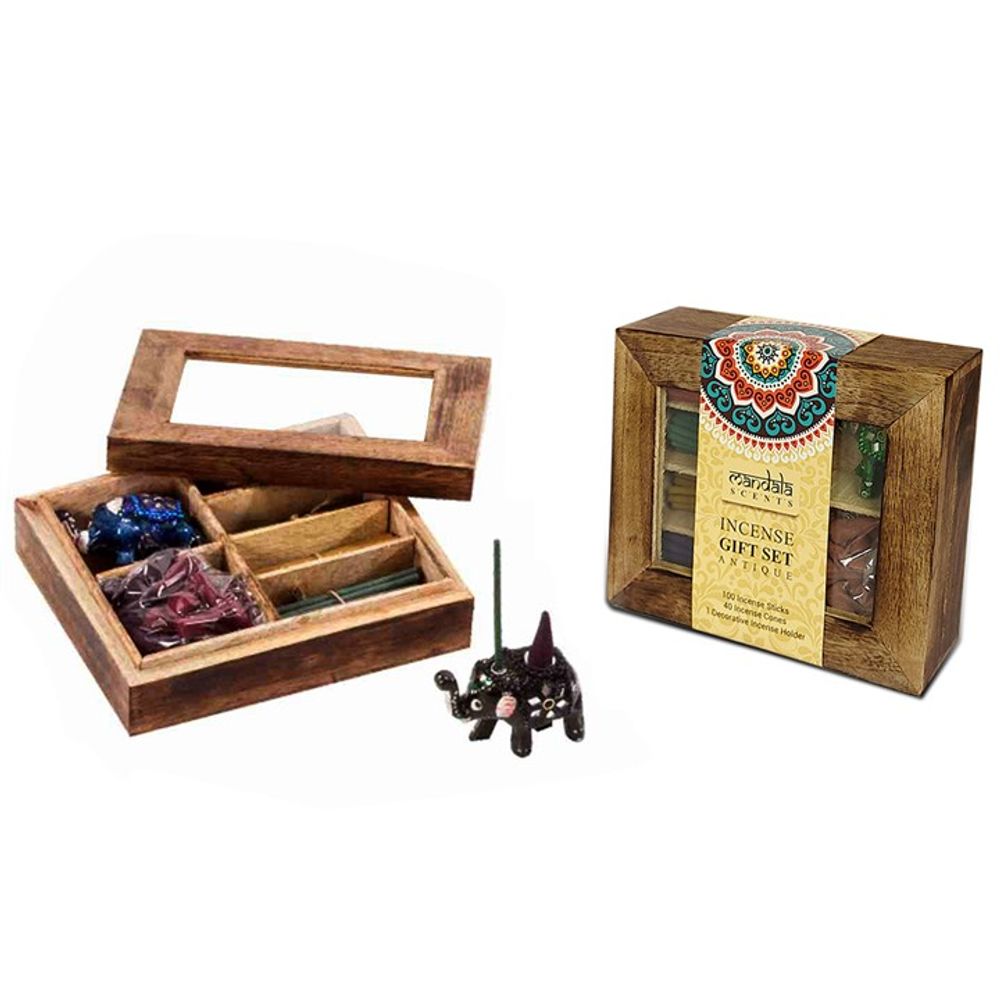 A wooden box with a transparent lid contains assorted incense sticks and cones in separate compartments. Beside it is a small black elephant-shaped incense burner, along with the closed box featuring decorative packaging labelled Incense Gift Set.