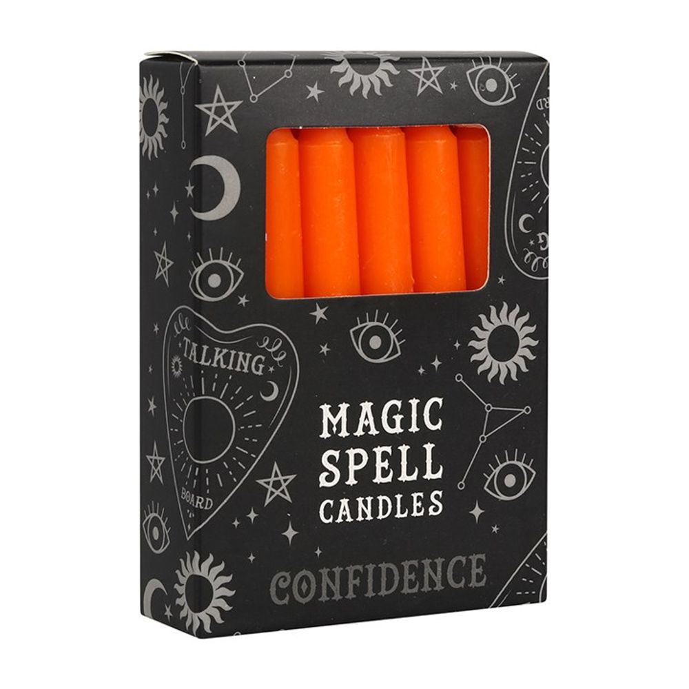 A box of Magic Spell Candles with orange candles visible through a plastic window. The black packaging, ideal for candle magic, features mystical designs—eyes, moons, stars—and the empowering words CONFIDENCE and TALKING BOARD.