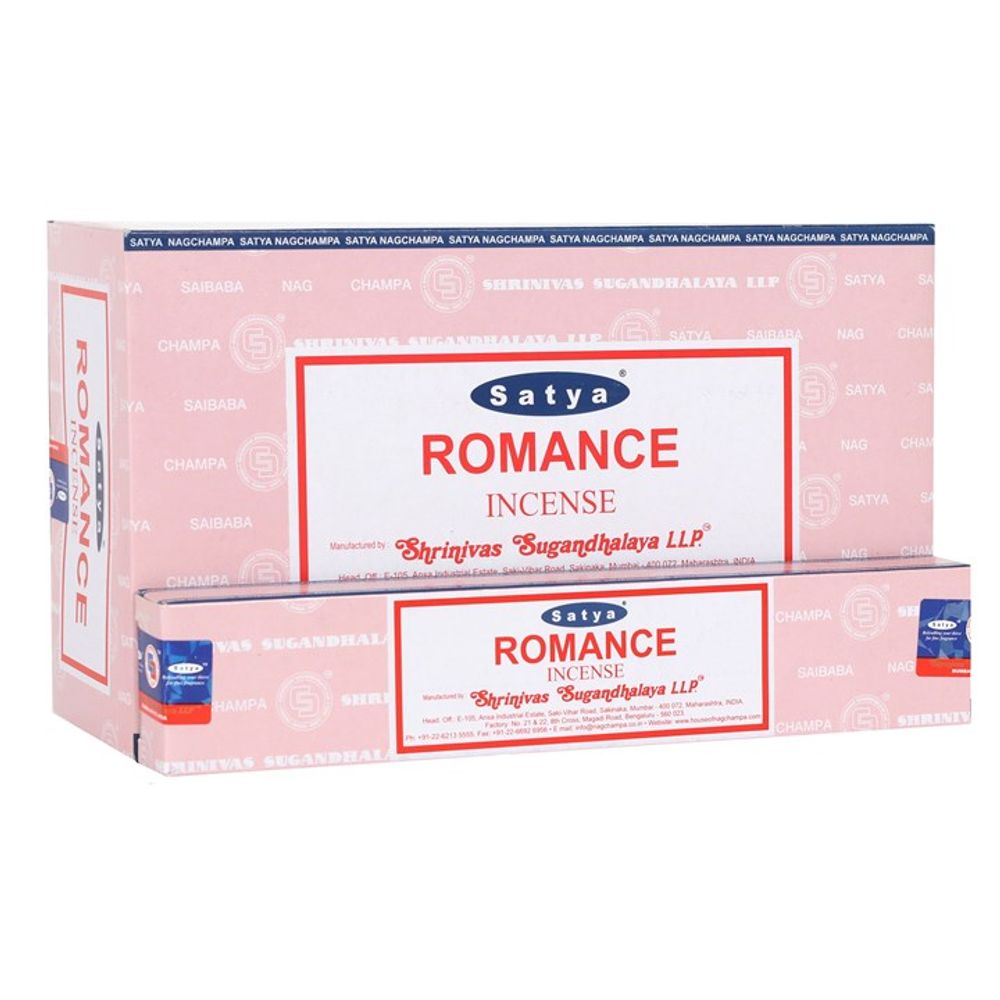 A pink cardboard box of Satya Romance Incense proudly displays red and white text. At its centre is the brands logo, with Shrinivas Sugandhalaya LLP clearly visible. The smaller, matching package in front contains handmade incense and mirrors the same elegant branding and design elements.