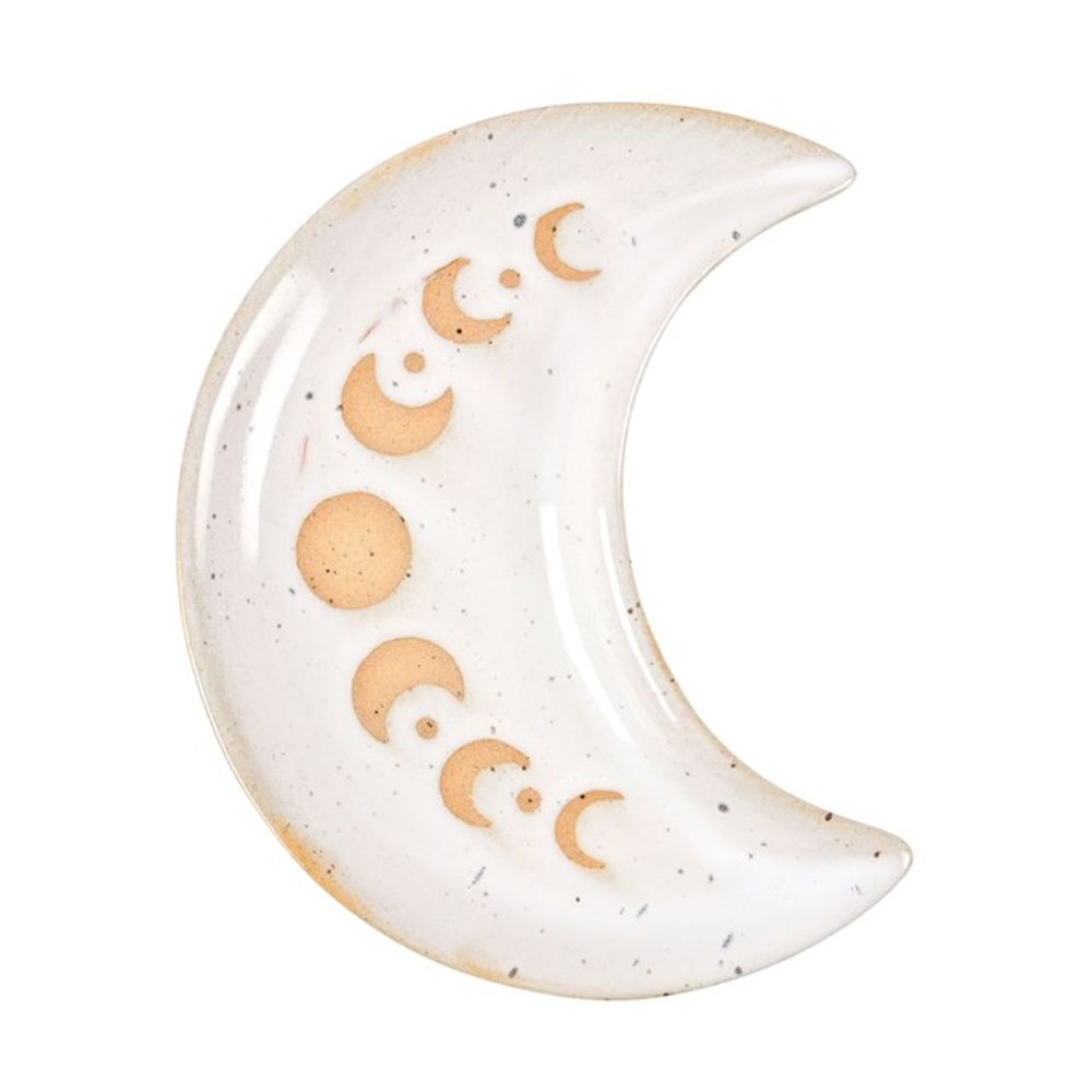 This beautiful ceramic crescent moon-shaped trinket dish, perfect for home decor enthusiasts, boasts a speckled white glaze and features a pattern of brown circles resembling moon phases. Its smooth surface has subtle variations in tone, adding charm to any space.