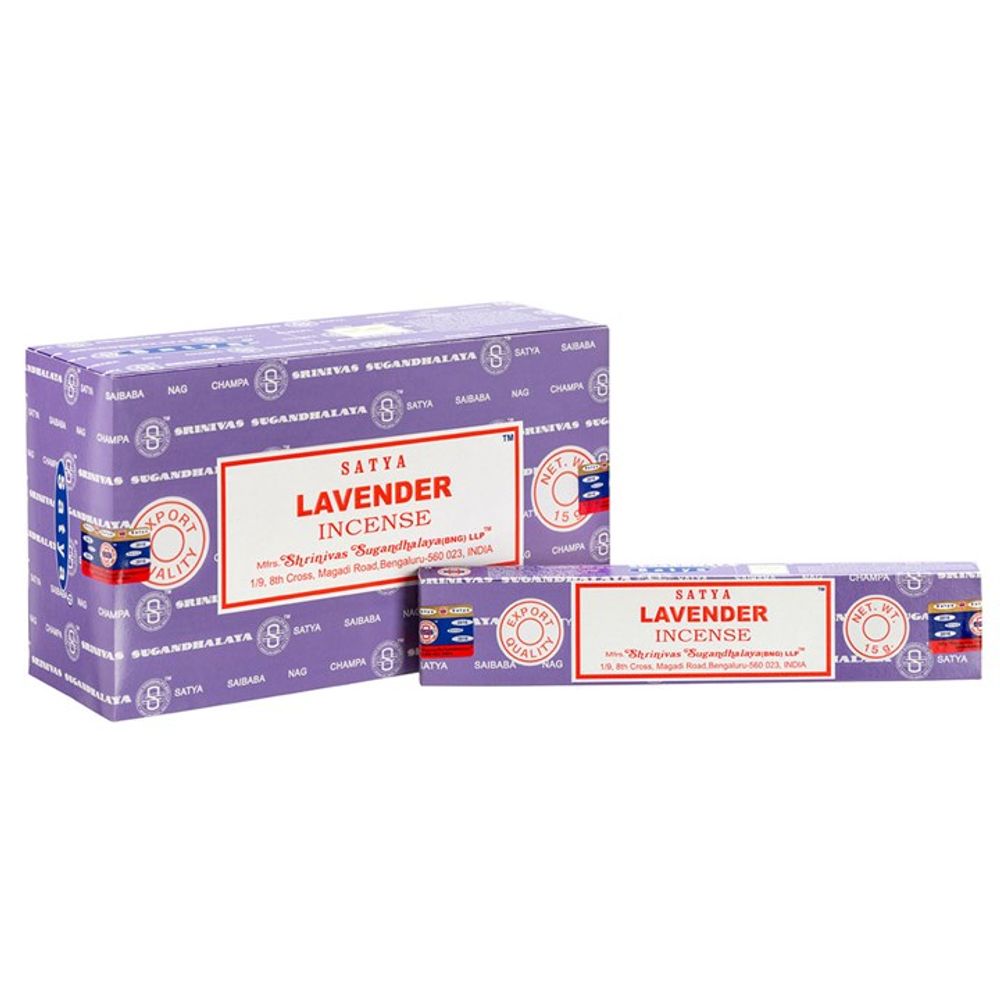 Two purple boxes of Satya Lavender Incense are displayed. The larger box stands upright, featuring logos and text describing the scent. Ideal for those looking for a restful sleep, the smaller box, which is also vegan-friendly, lies horizontally in front. Both boxes showcase red, white, and blue design elements with branding details.