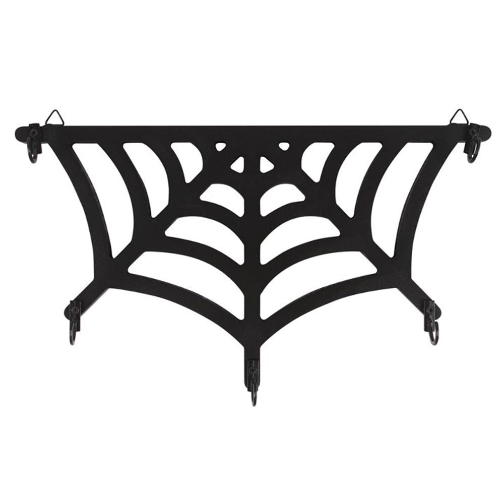 A geometric, black metal garden trellis shaped like a stylised spiders web. Featuring triangle hooks along the edges, it’s perfect for supporting climbing plants or hanging decorations.