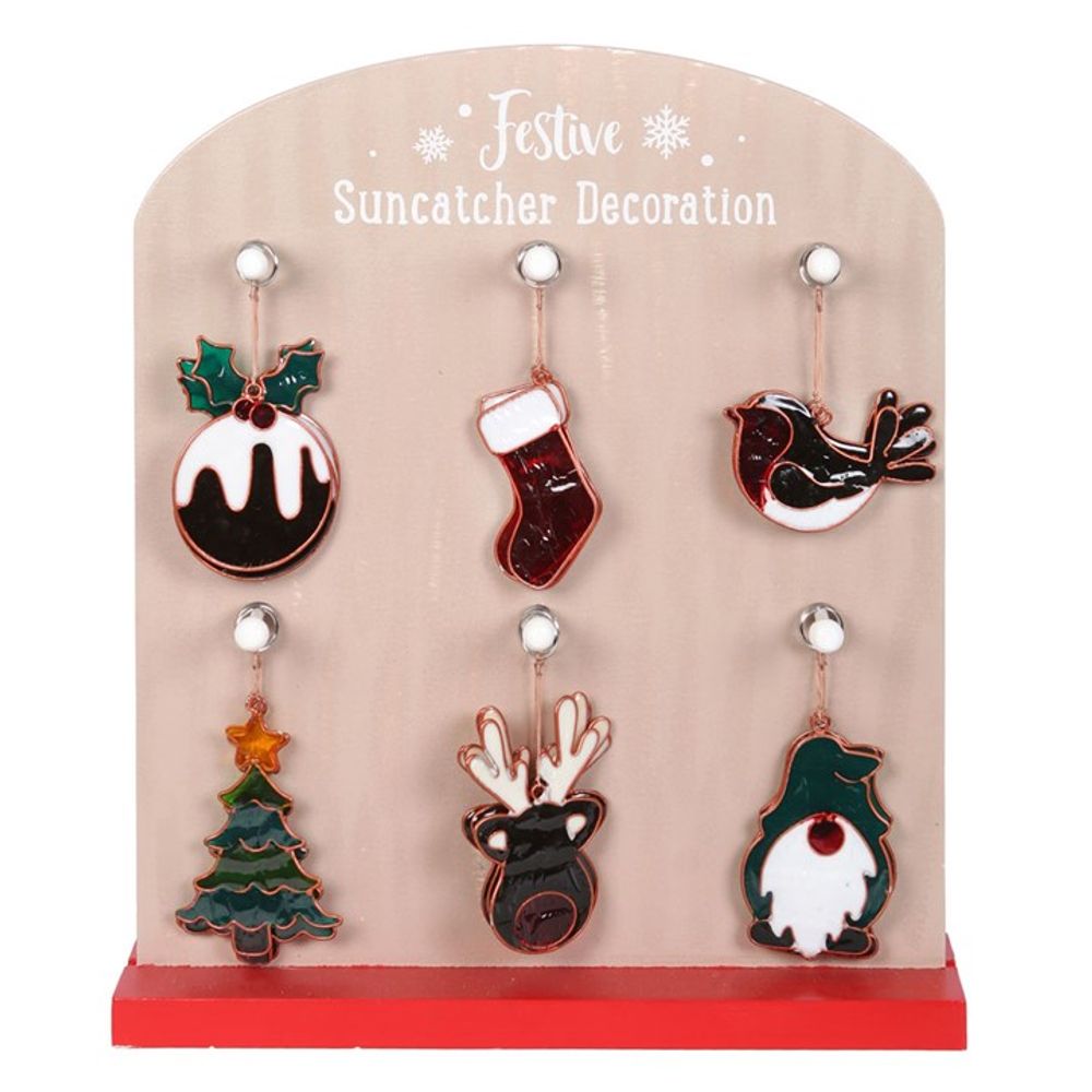A stand displaying six vibrant Christmas suncatchers: a pudding, stocking, bird, tree with star, reindeer head, and gnome. Perfect window decorations for the festive season! The stand reads Festive Suncatcher Decoration at the top.