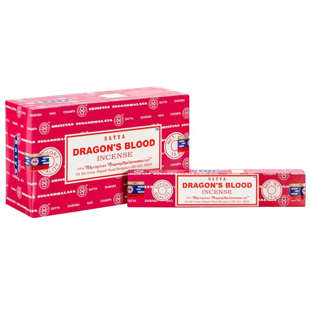 The red packaging of Satya Dragons Blood incense sticks features ornate white patterns, brand logos, and text on a larger box, with a smaller angled box in front. Both include certification stamps and product details, reflecting the artisanal handmade quality of the incense within.