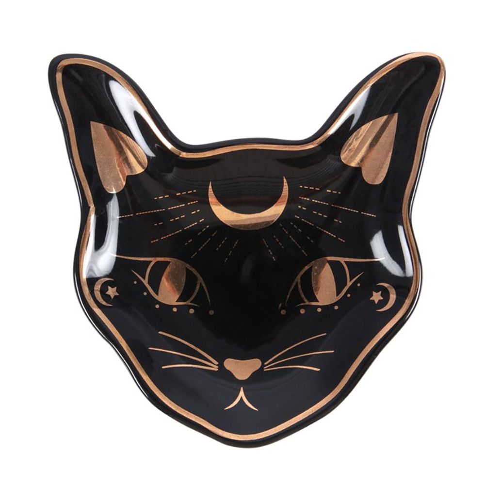 Ceramic trinket dish shaped like a mystical cats face, this piece features a crescent moon on the forehead and wide eyes with star motifs. Gold foil accents enhance its celestial charm, creating a truly enchanting design.