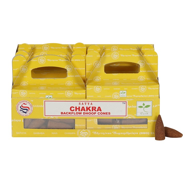 Two yellow boxes labelled Satya Chakra Backflow Dhoop Cones sit side by side with carrying handles. The boxes feature windows displaying brown Chakra incense cones inside, and two cones—perfect for a backflow incense burner—are placed in front.