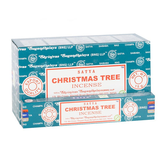 Two turquoise boxes of Satya Christmas Tree incense sticks are stacked, featuring white text, red labels, and “Export Quality”. These vegan-friendly incense sticks come in 15g packs with decorative elements throughout.