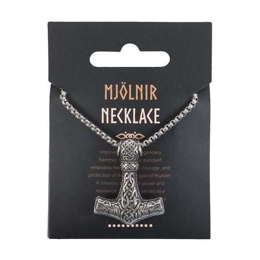 A silver metal Mjölnir necklace with a finely detailed Thors hammer pendant featuring intricate engravings, presented on a black card marked MJÖLNIR NECKLACE, honouring the might of the Norse gods.