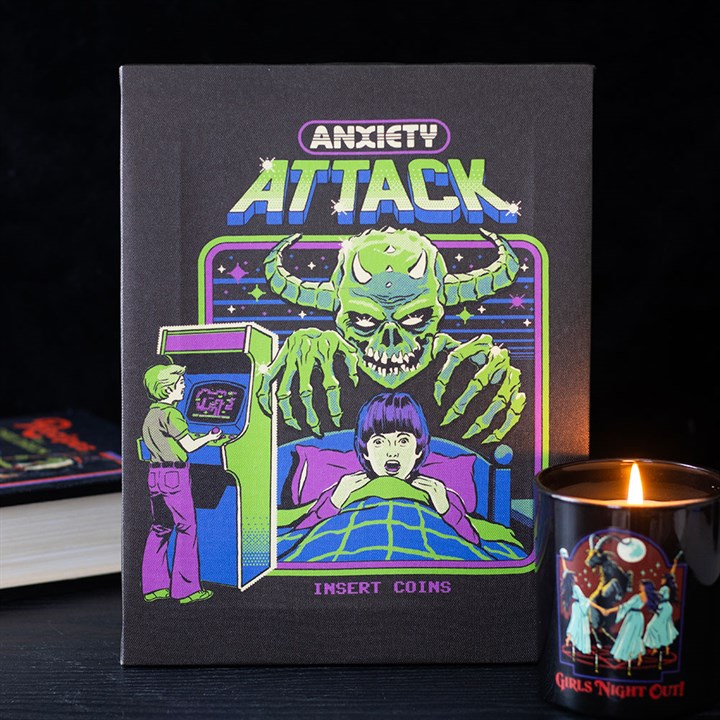 A book cover titled “Anxiety Attack” in retro arcade style features a frightened person in bed with a green monster behind them, and a child playing an arcade game—perfect retro arcade décor for any room.
