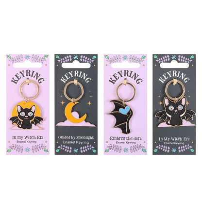 Set of 24 Cute and Creepy Keyrings on Display