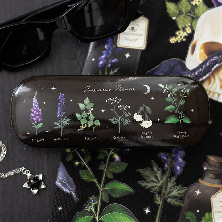 A dark glasses case labelled Poisonous Plants features a gothic aesthetic, with illustrations of foxglove, wolfsbane, poison ivy, hemlock, angel’s trumpet, deadly nightshade, stars, a moon and each plant’s name beneath.