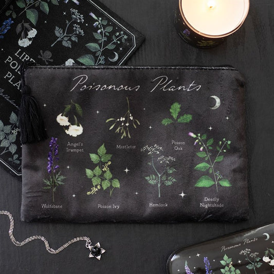 A black make-up bag labelled “Poisonous Plants” features a striking design with illustrations of Angel’s Trumpet, Mistletoe, Wolfsbane, and more, surrounded by dark botanical elements and a candle.
