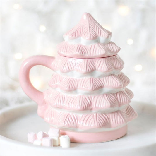 A pink Christmas tree mug with a lid rests on a white plate, surrounded by pastel marshmallows. Softly blurred white fairy lights in the background make it ideal for festive hampers or Christmas Eve boxes.